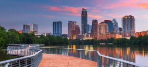 Austin, Texas, USA downtown skyline from the hike and bike trail near the Colorado River at dawn.