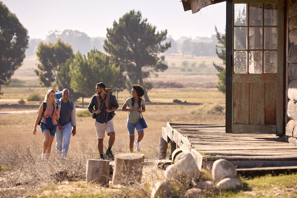 Group Of Friends With Backpacks Hiking