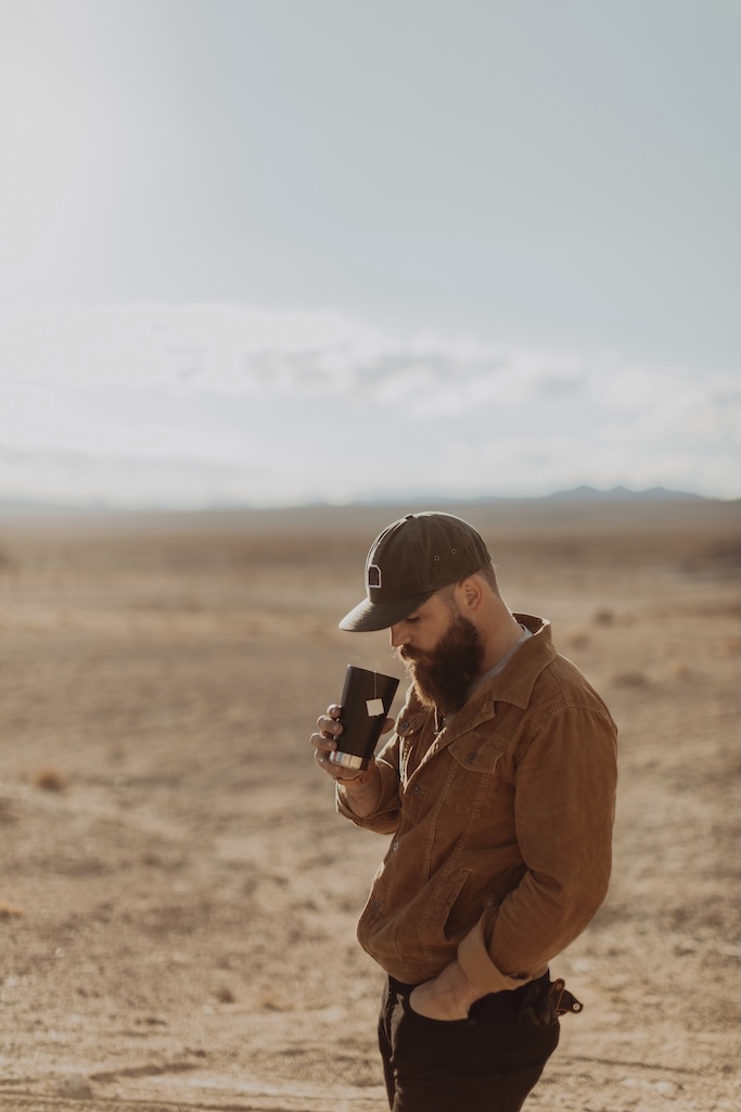 Man enjoying cup of tea in desert