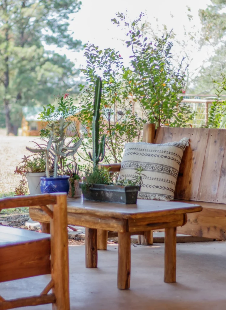 A shaded porch seating area on the grounds at The Last Resort.